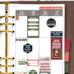 Weekly planner spread filled with book-themed stickers, including reading trackers, quotes, and decorative elements, with coordinating stickers and a pen placed above the planner.