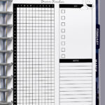 Close-up of the dream tracker page inside a discbound planner, showing the grid for all 12 months, key checkboxes, and notes area.