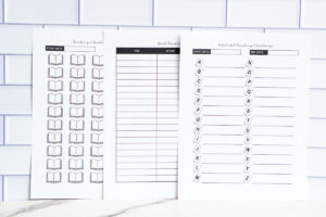 Three printable reading challenge sheets displayed together: a numbered book-icon challenge, a book tracker, and an A&ndash;Z alphabet reading challenge page.