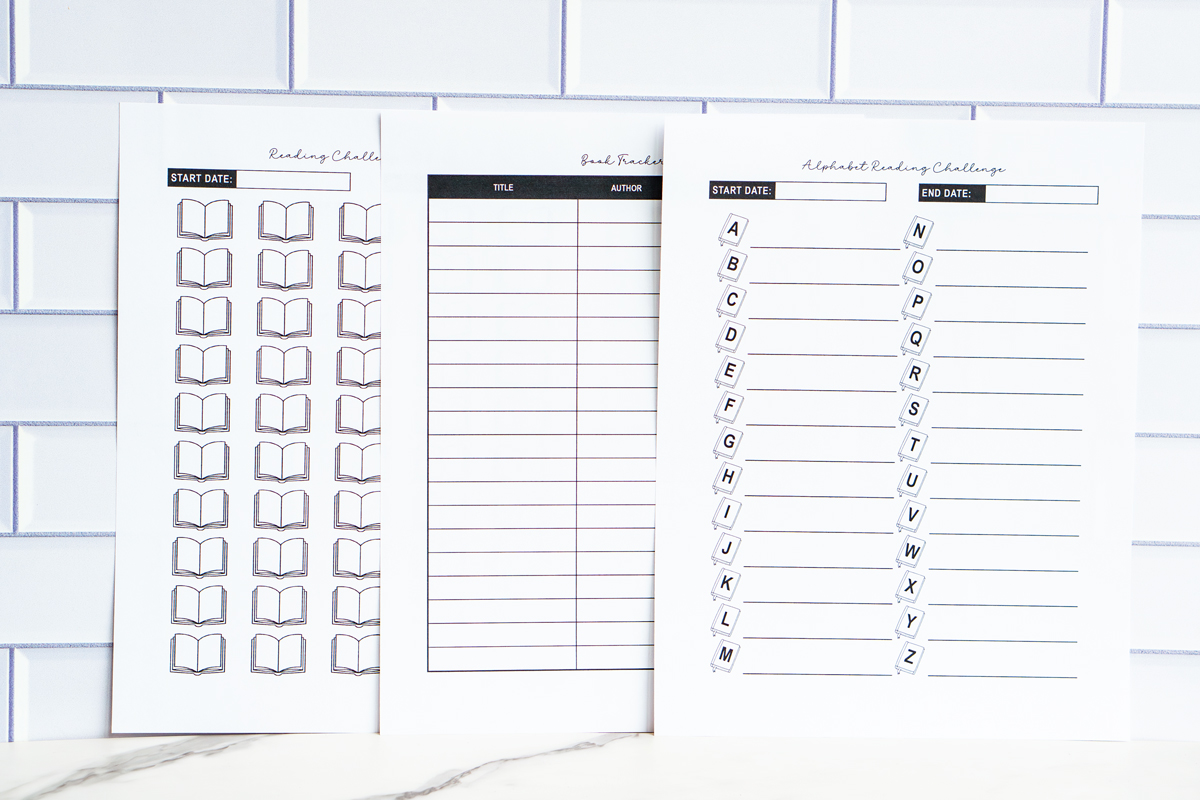 Three printable reading challenge sheets displayed together: a numbered book-icon challenge, a book tracker, and an A–Z alphabet reading challenge page.
