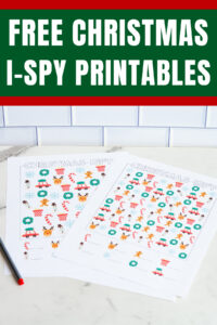 Pinterest graphic titled &ldquo;Free Christmas I-Spy Printables&rdquo; with two colorful I-Spy game sheets shown underneath.