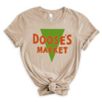 Beige T-shirt with the bold green and orange “Doose’s Market” logo centered on the front.