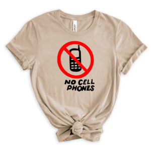 Light beige t-shirt with a red circle-and-slash no-phone graphic above the words &ldquo;No Cell Phones&rdquo; in black, styled with rolled sleeves and a front knot.