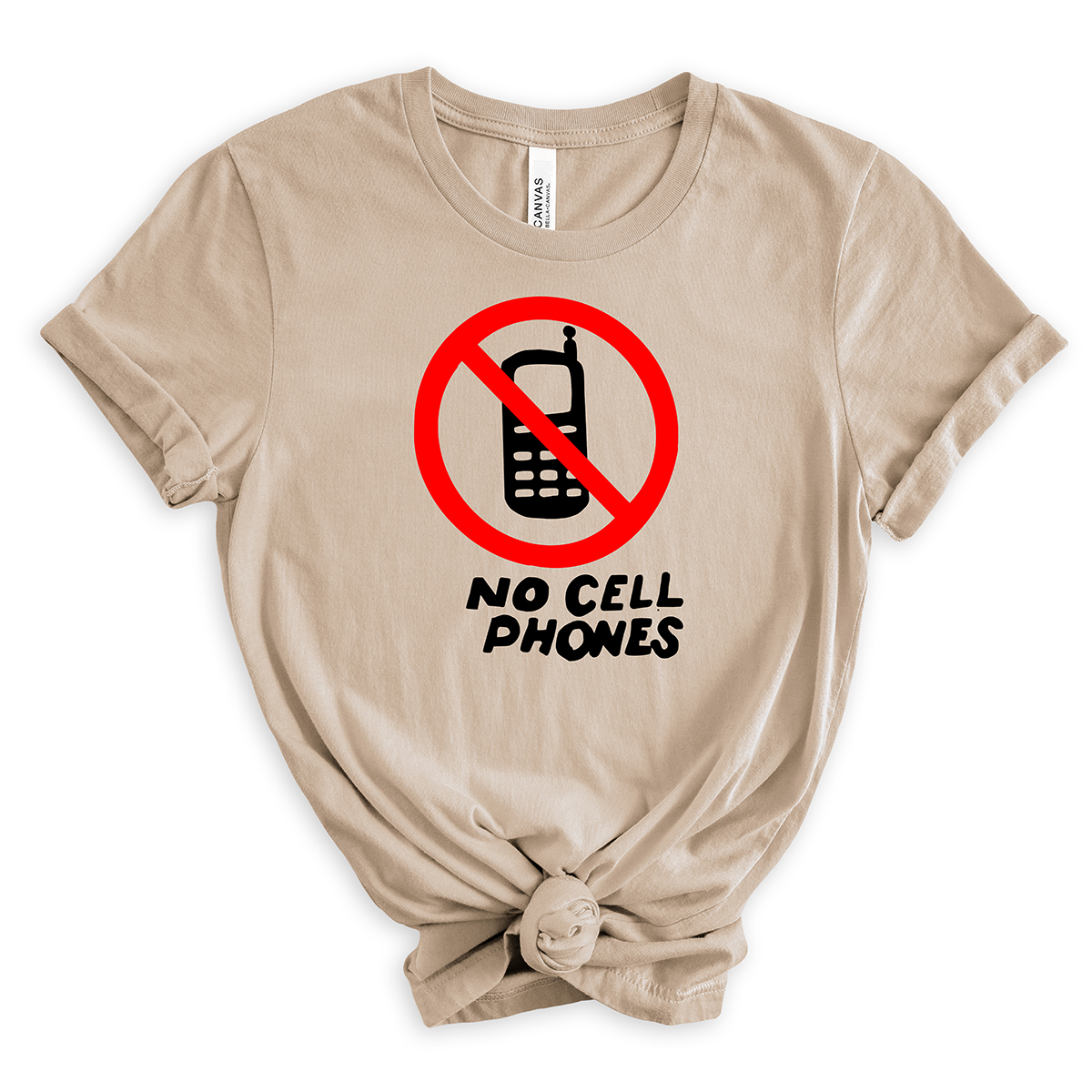 Light beige t-shirt with a red circle-and-slash no-phone graphic above the words “No Cell Phones” in black, styled with rolled sleeves and a front knot.