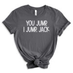 Gray t-shirt with the iconic phrase “You jump, I jump, Jack” in bold white lettering, styled with rolled sleeves and a front knot.