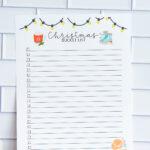 Christmas bucket list printable with wide evenly spaced lines and checkboxes, decorated with string lights, a cocoa mug, and ice skates.