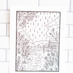 Printable relaxation coloring page featuring a garden scene with a bench, flowers, and rain falling from the sky, displayed against a white tiled background.