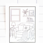 Printable indoor relaxation coloring page showing a cozy reading nook with an armchair, blanket, pillows, lamp, books, and houseplants.