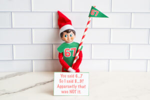 One Elf on the Shelf shown with a 67 shirt, a 67 flag, and a card saying &ldquo;8&hellip;9?&rdquo; was apparently not the right answer to &ldquo;6&hellip;7.&rdquo;