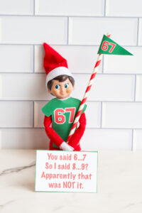 One Elf on the Shelf shown with a 67 shirt, a 67 flag, and a card saying &ldquo;8&hellip;9?&rdquo; was apparently not the right answer to &ldquo;6&hellip;7.&rdquo;