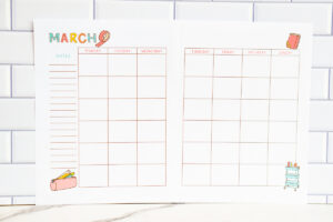 March craft-themed undated calendar page on a white subway while backdrop with a marble countertop.