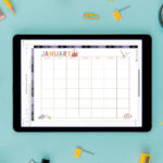 Digital tablet displaying the January craft-themed undated calendar on a teal background, surrounded by yellow stationery, paint jars, scissors, clips, and craft tools.