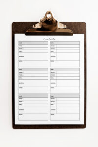 A printable contact list page with six boxed contact sections clipped onto a brown clipboard, photographed against a clean white background.