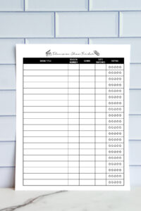 A simple black-and-white TV show tracking sheet displayed on a tile wall background. It includes columns for show title, season number, genre, date watched, and a star-rating section.