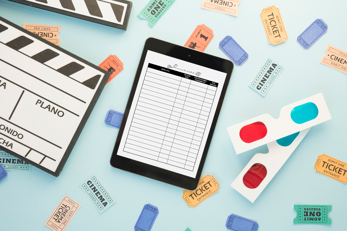 Tablet displaying a printable &ldquo;Movies to Watch&rdquo; tracker, surrounded by colorful cinema tickets, a clapperboard, and retro 3D glasses on a light blue background.