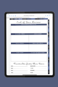 iPad displaying the End of Year Review page from the portrait digital planner, with sections for memories, accomplishments, lessons learned, difficult moments, people spent time with, places visited, and yearly favorites.