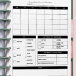 Monthly period tracker printable inserted into a disc-bound planner with a blank monthly calendar, symptom checklist, period stats section, and notes area, displayed on a soft pink background.