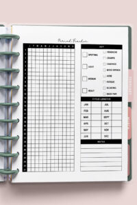A printable period tracker page inserted into a ring-bound planner, featuring a full-year grid on the left and symptom checkboxes, cycle length chart, and notes section on the right. Planner tabs for February and March peek out along the side.