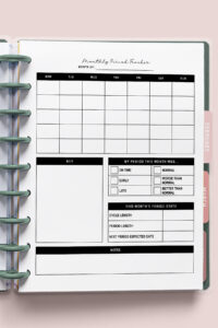Monthly period tracker printable in a disc-bound planner showing a blank calendar and empty symptom key section, with the page tabs for February and March visible on the right.