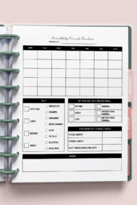 Yearly period tracker planner page inside a disc-bound system, featuring a full 12-month daily tracking grid, blank symptom key area, cycle length chart, and lined notes section.