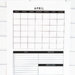 Vertical undated April monthly calendar page featuring a full grid and bottom sections labeled To Do, Important, and Monthly Focus, displayed against a white subway tile backsplash.
