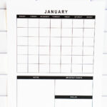 Vertical undated January monthly calendar page with grid layout and three planning boxes labeled Notes, Important Events, and Goals, displayed against a white subway tile backsplash.