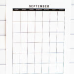 Clean, vertical undated September calendar page with a black-and-white heading, displayed against a white tile background.