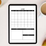 Digital tablet on a light workspace displaying an undated June monthly calendar with sections for notes, important events, and goals. A cup of coffee, fruit, and a dish with wooden utensils are arranged around it.