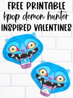 A Pinterest-style vertical graphic reads &ldquo;FREE PRINTABLE KPOP DEMON HUNTER INSPIRED VALENTINE CARDS&rdquo; in large black and white text over purple bands. Below the text, two blue Derpy Valentine cards are angled playfully on a white subway tile background, showing their glowing eyes and toothy smiles while holding Valentine cards in their mouths.