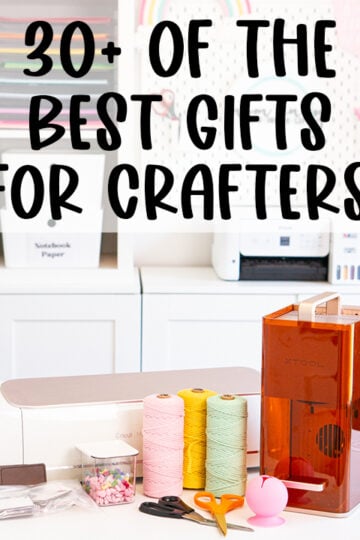 Pinterest-style graphic for a crafter gift guide featuring a bright craft room and a table filled with crafting supplies and machines, including a Cricut cutting machine, xTool laser machine, colorful spools of twine, scissors, craft blanks, a small storage container, and a pink vinyl scrap collector. Large black text across the top reads “30+ of the Best Gifts for Crafters.”