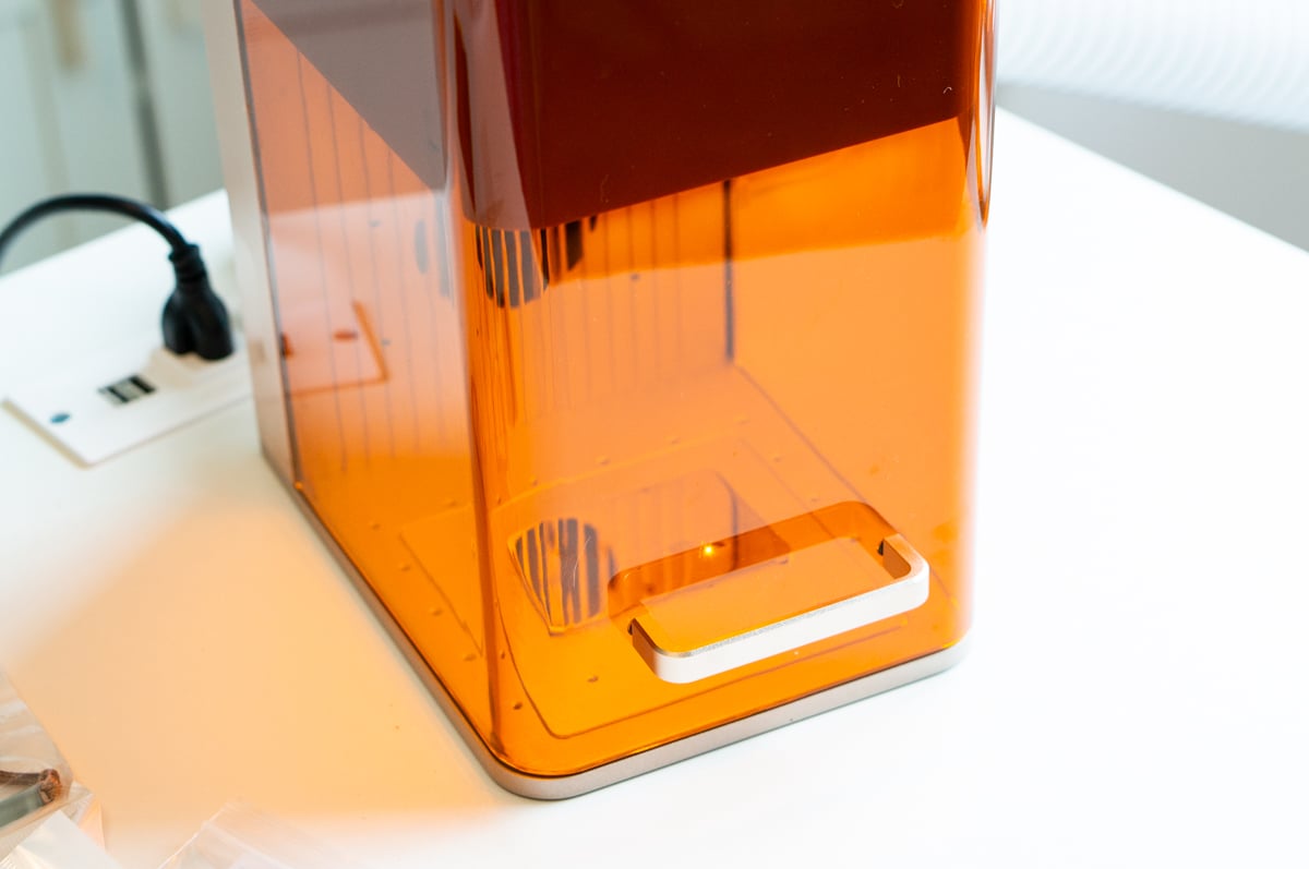 Metal jewelry blank positioned inside the xTool F2 for laser engraving