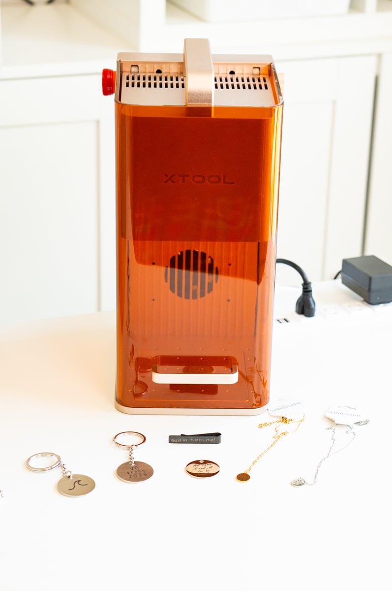 xTool F2 laser engraver with personalized metal keychains and necklaces engraved with custom designs